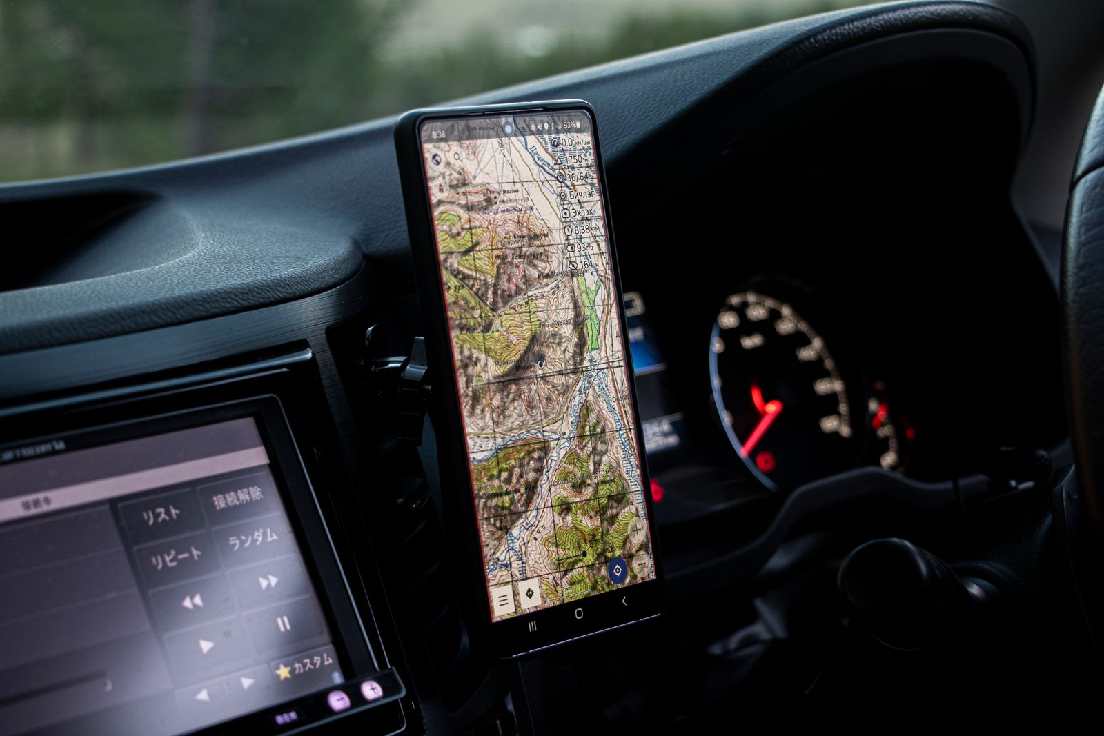 Car dashboard with GPS navigation showing a route