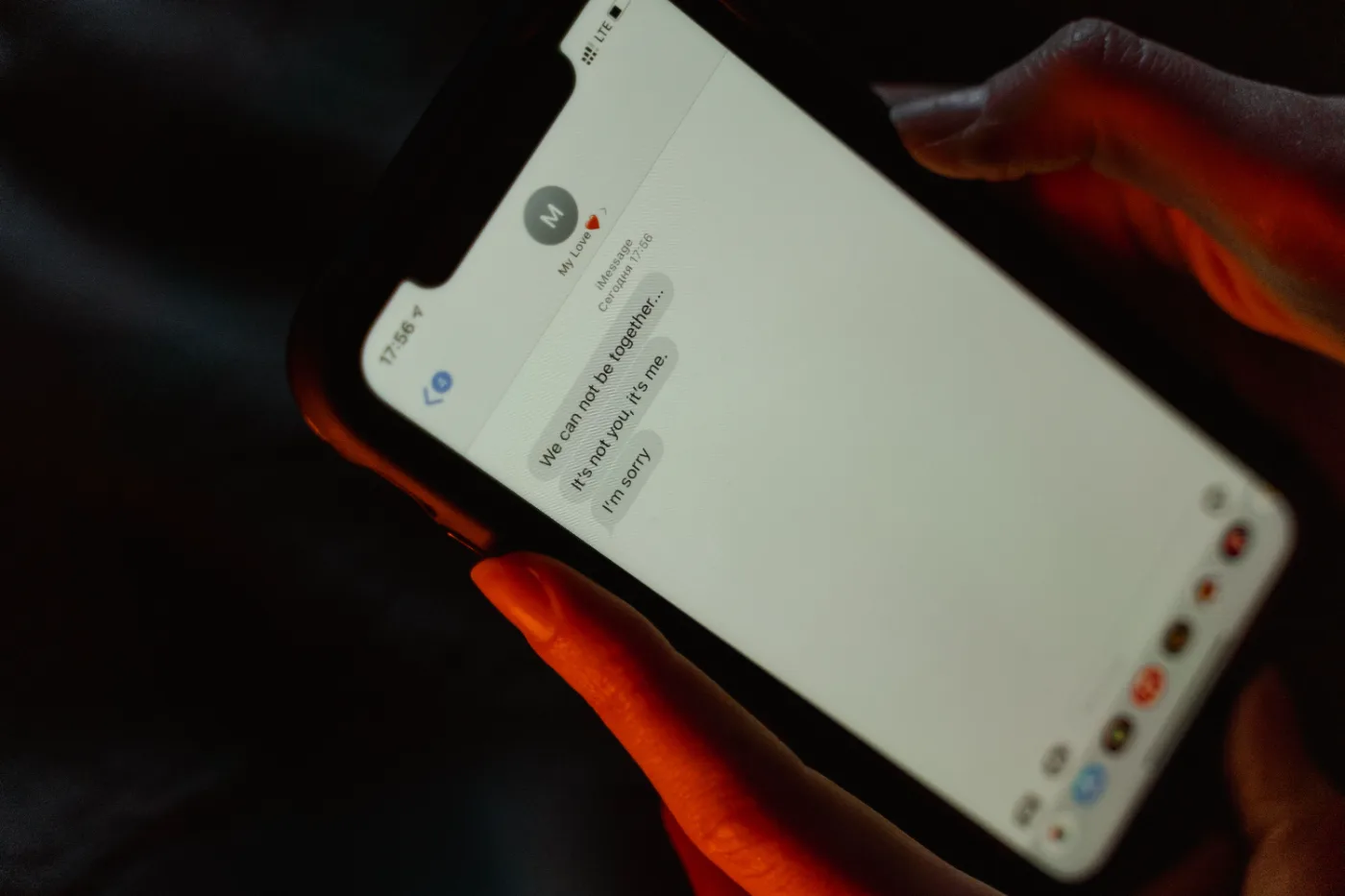 Person typing a text message on a smartphone