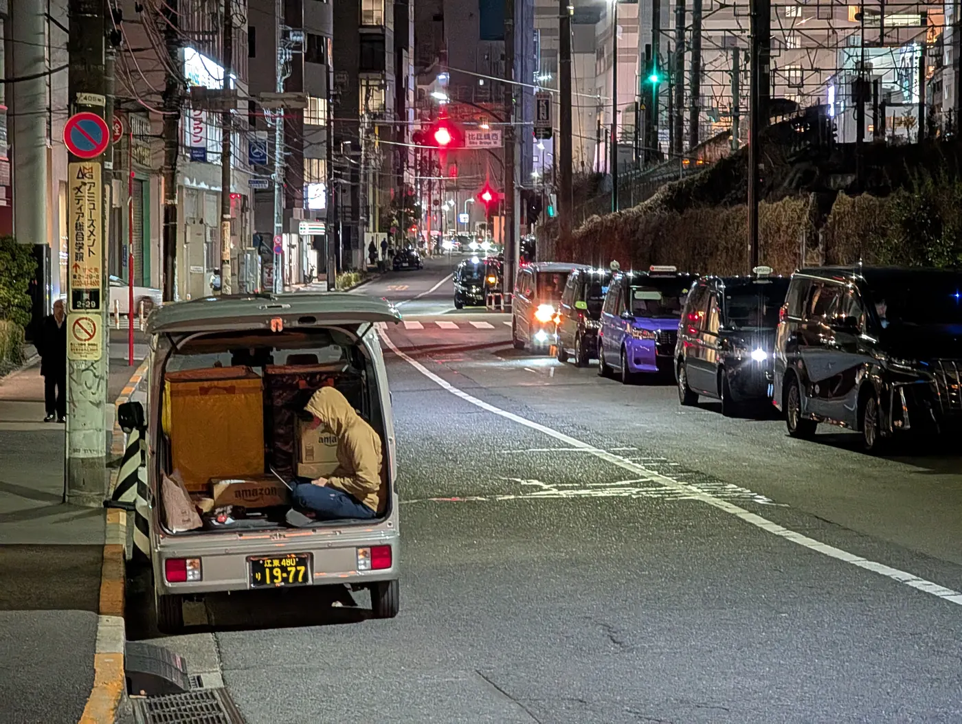 Mobile worker reviewing admin from a vehicle between visits