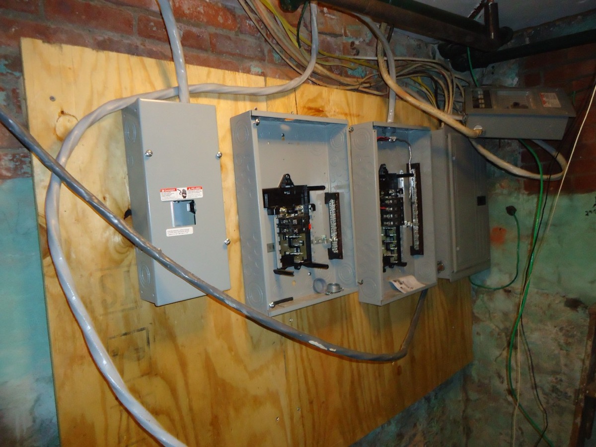Electrical panels during a property renovation with separated wiring