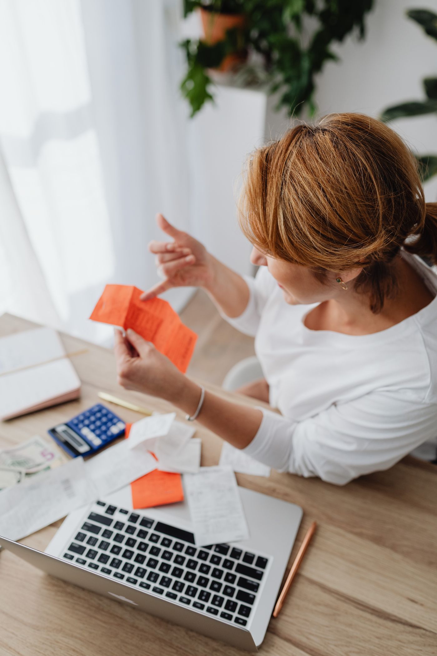 Receipts and calculator arranged for expense review