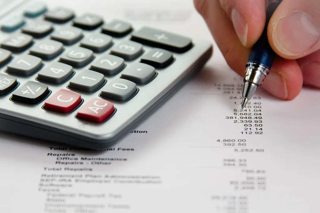 Calculator and invoice totals on paperwork