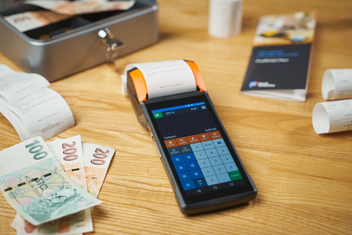 Card terminal and receipts on a small business desk