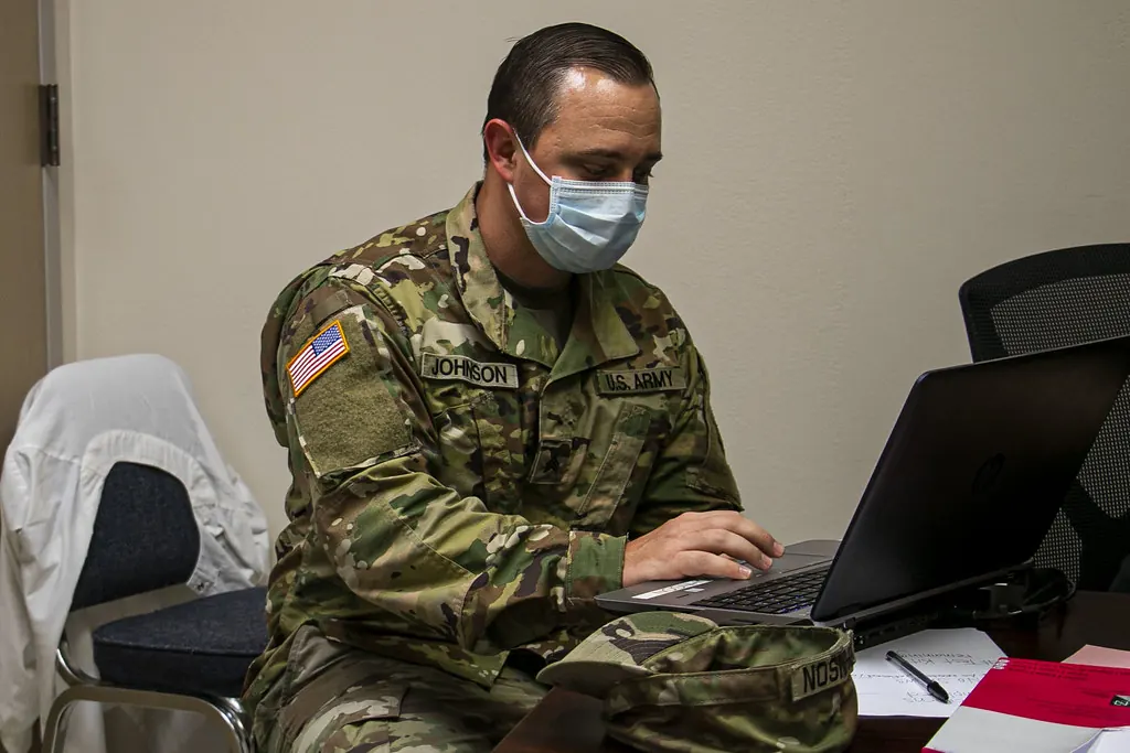 Office worker filing appointment paperwork at a desk